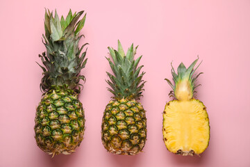 Fresh pineapples on color background