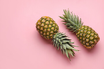 Fresh pineapples on color background