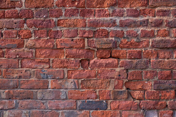 victorian cracked red brick wall