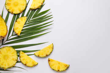 Slices of fresh pineapple on white background