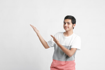 young indian boy showing expression on white background