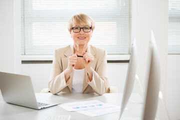 Portrait of senior business woman working in an office