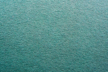 Colored paper with strong structure as a background, photographed in the studio