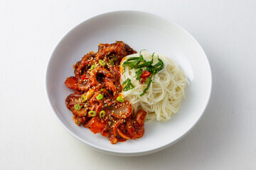 Spicy Squid Stir Fry which is called Ojingeo Bokkeum with thin white noodle
