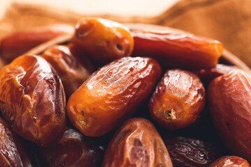 Bowl with sweet dried dates, closeup