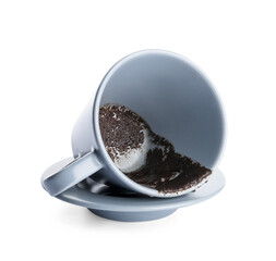 Cup with spent coffee grounds for fortune telling on white background