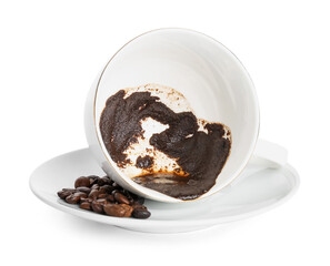 Cup with spent coffee grounds for fortune telling on white background