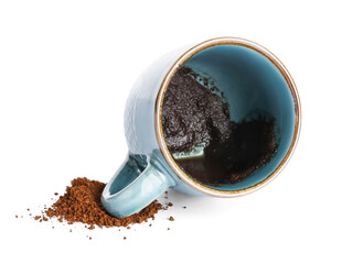 Cup with spent coffee grounds for fortune telling on white background