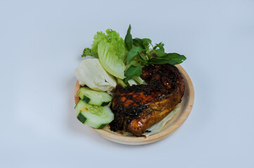 Ayam Penyet / grilled chicken, this food is a traditional food from Java made from grilled chicken with spicy shrimp paste.