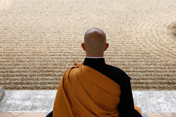 Zen Buddhist master practising Zazen (meditation) in Orval Trappist Abbey's Zen garden, Belgium