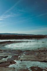 Geyser in Iceland before the eruption by the name if Strokkur Geysir.   