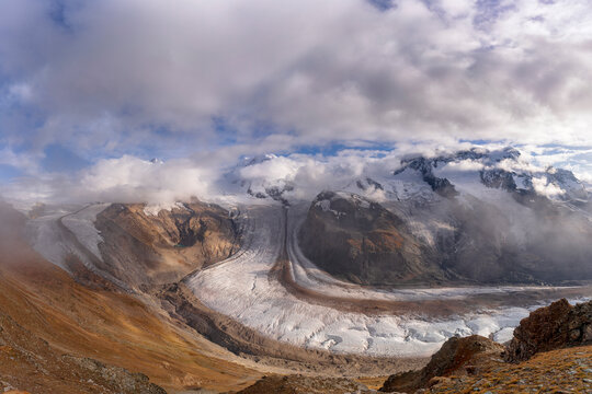 Cloudy sky over snowcapped mountains and Gorner Glacier (Gornergletscher), Zermatt, canton of Valais, Switzerland