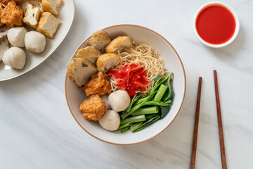 egg noodles with fish balls and shrimp balls in pink sauce, Yen Ta Four or Yen Ta Fo