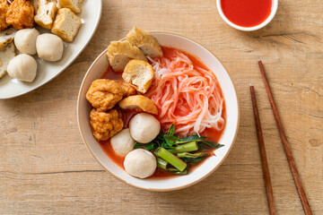 small flat rice noodles with fish balls and shrimp balls in pink soup, Yen Ta Four or Yen Ta Fo