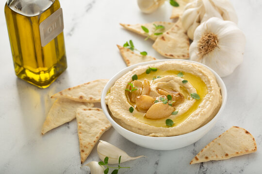 Roasted garlic hummus topped with olive oil