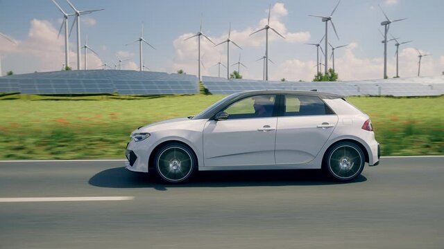 Generic autonomous electric car driving through a vibrant green landscape with solar panels and wind turbines in background. Green energy concept. Realistic high quality 3d animation. 