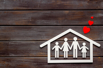 Family figure in house with heart. Happy family, protection and insurance concept