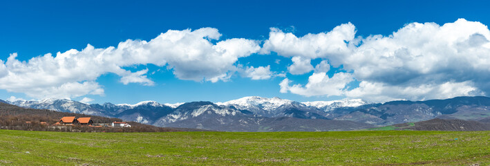 Wide angle mountain landscape with clouds