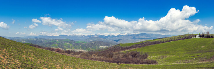 Wide angle mountain landscape with clouds