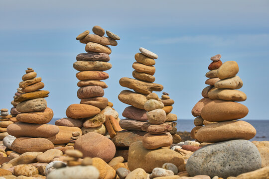 Stone trolls piled up on the shore at Lindisfarne, Holy Island, Northumberland, northeast England, United Kingdom
