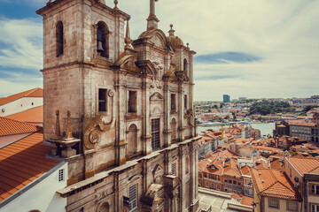 Historical houses and narrow streets of the city with colorful walls and rustic textures. Porto.