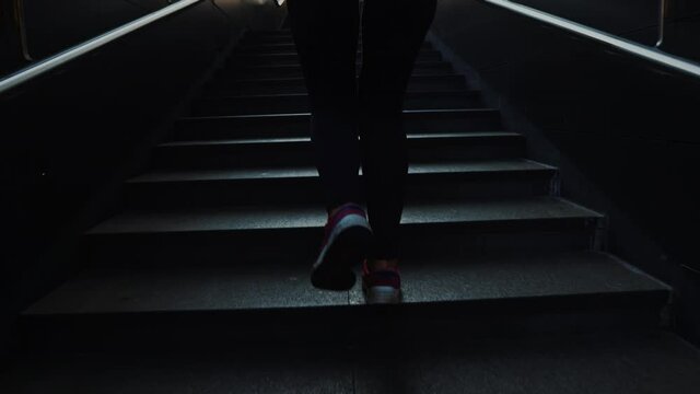Close view of young woman athlete feet running up stairs training intense