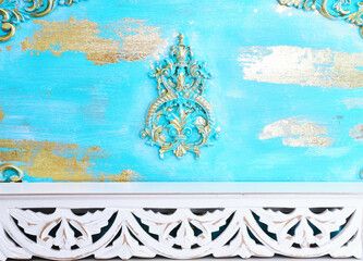 background Image of white wooden vintage table in front of decorative oriental wall. ready for product display