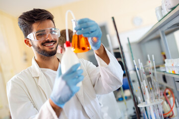 Young scientist student man working at the laboratory