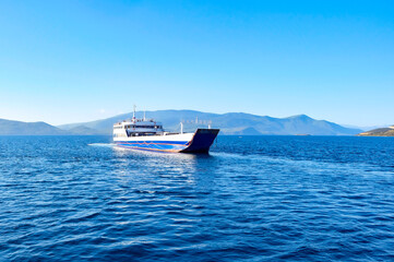 Skiathos island (Skiathos) in Greece. White ship in the harbor on the sea azure sea