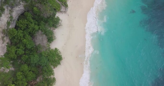 Kelingking Beach, Nusa Penisa Island, Bali, Indonesia, Tilt Down Drone Aerial View