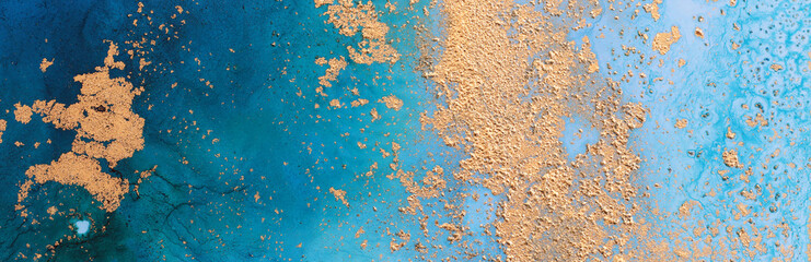 art photography of abstract fluid painting with alcohol ink, blue and gold colors