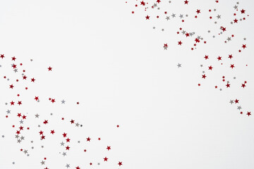 Happy Canada Day banner design. Frame of star shaped red and white confetti on white background.