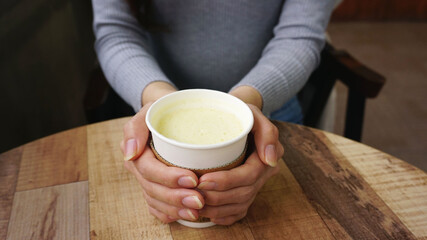 person with cup of tea