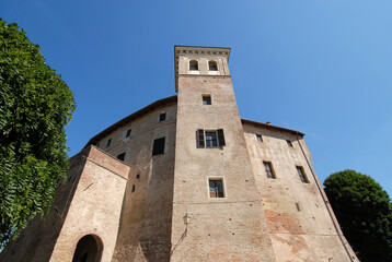 Fototapeta na wymiar The castle of Moncucco in Monferrato dates back to the XIV-XV centuries. It is a grand building. The large tower protrudes on one of the sides.