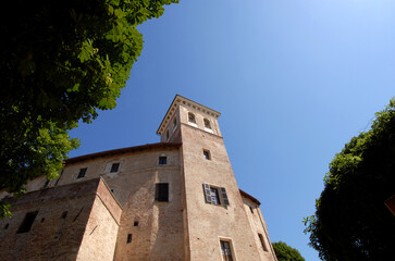 Fototapeta na wymiar The castle of Moncucco in Monferrato dates back to the XIV-XV centuries. It is a grand building. The large tower protrudes on one of the sides