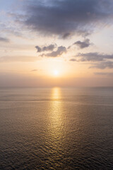 sunset sun over the mediterranean sea with reflection on the water