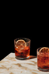 Negroni, an italian IBA cocktail with gin, bitter and vermouth; in luxury elegant home, homemade drink