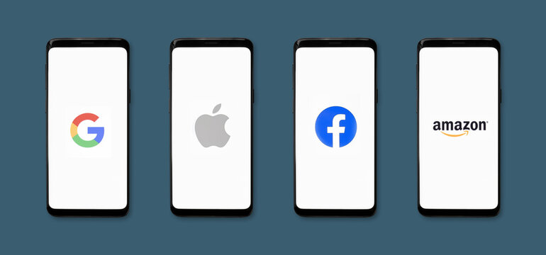GAFA icons on smartphone screens with blue background banner - Google, Apple, Facebook, Amazon