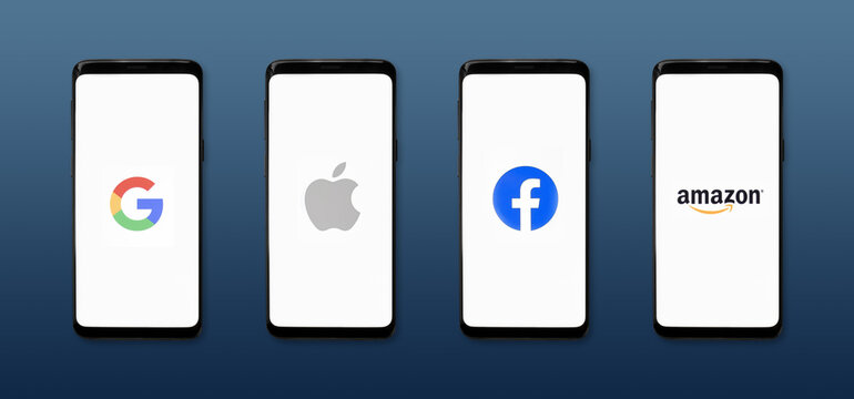 GAFA icons on smartphone screens on dark blue background banner - Google, Apple, Facebook, Amazon