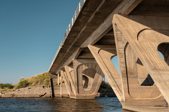 Large old concrete bridge over a river in Argentina.