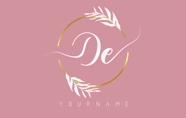 DE d e Letters logo design with golden circle and white leaves on branches around. Vector Illustration with D and E letters.