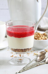 Ricotta with nuts and currants on white background