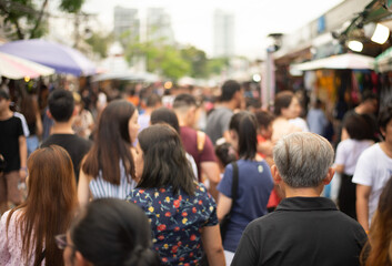 The crowd of anonymous people walking and shopping at the weekend market at Jatujak market Bangkok...