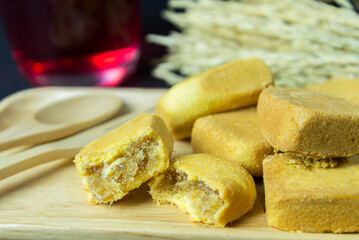 Pineapple shortcake or Pineapple pastry pie cake with pineapple jam on wooden tray. Sweet traditional Taiwanese pastry containing butter. fruit. dessert.