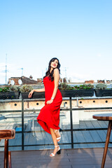 Woman wearing red dress outdoor