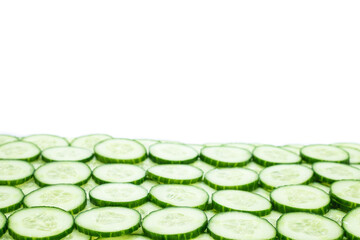 Fresh green slices of cucumber as background.