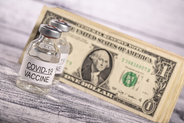covid-19 coronavirus vaccin vaccination dollars argent monnaie billet