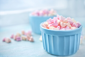 Marshmallow like hearts in a ceramic bowls