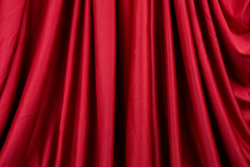 Texture, background, template. Silk fabric. Red silk drapery and upholstery fabric. Solid fabrics for backdrop, drapes, flags and curtains