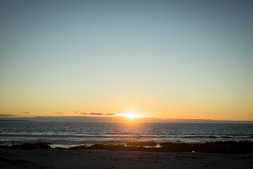 Obraz premium Sunset on beach at the sea